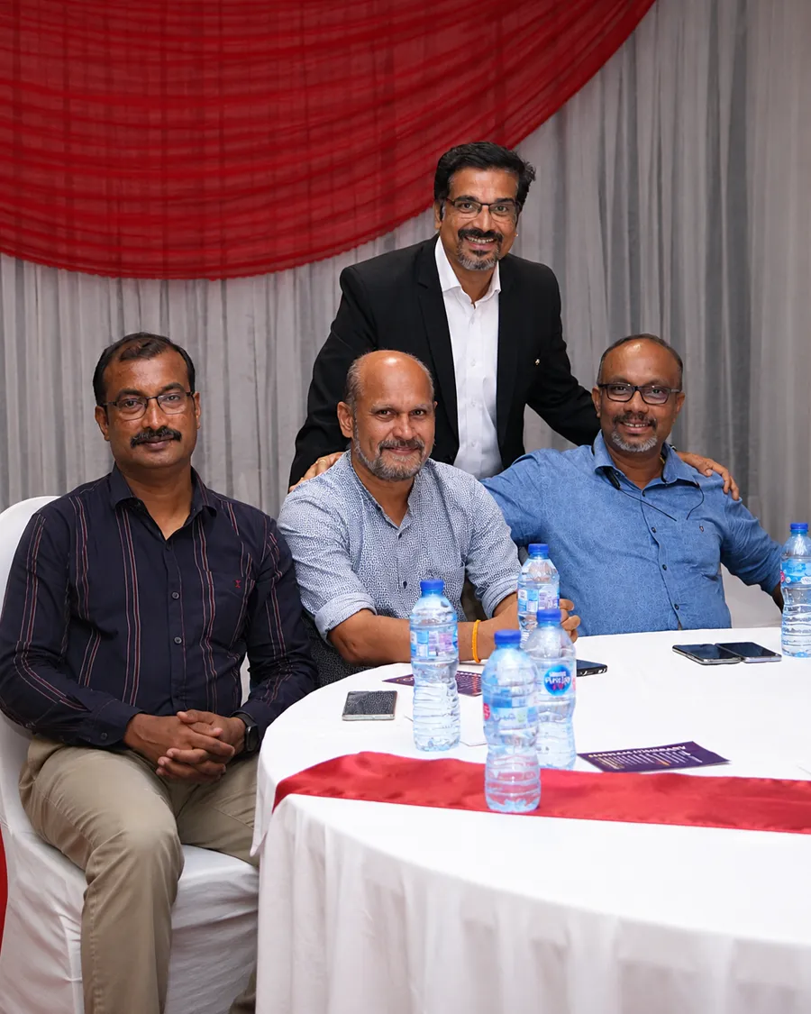Asentforce corporate team members collaborating during a business meeting in an office.