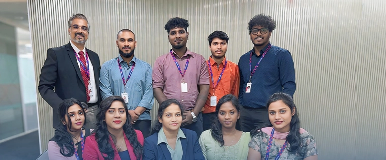 Asentforce diverse professional team posing together for a corporate group photo.