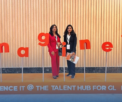 Asentforce professionals posing together at the Global Tech Talent Hub exhibition.